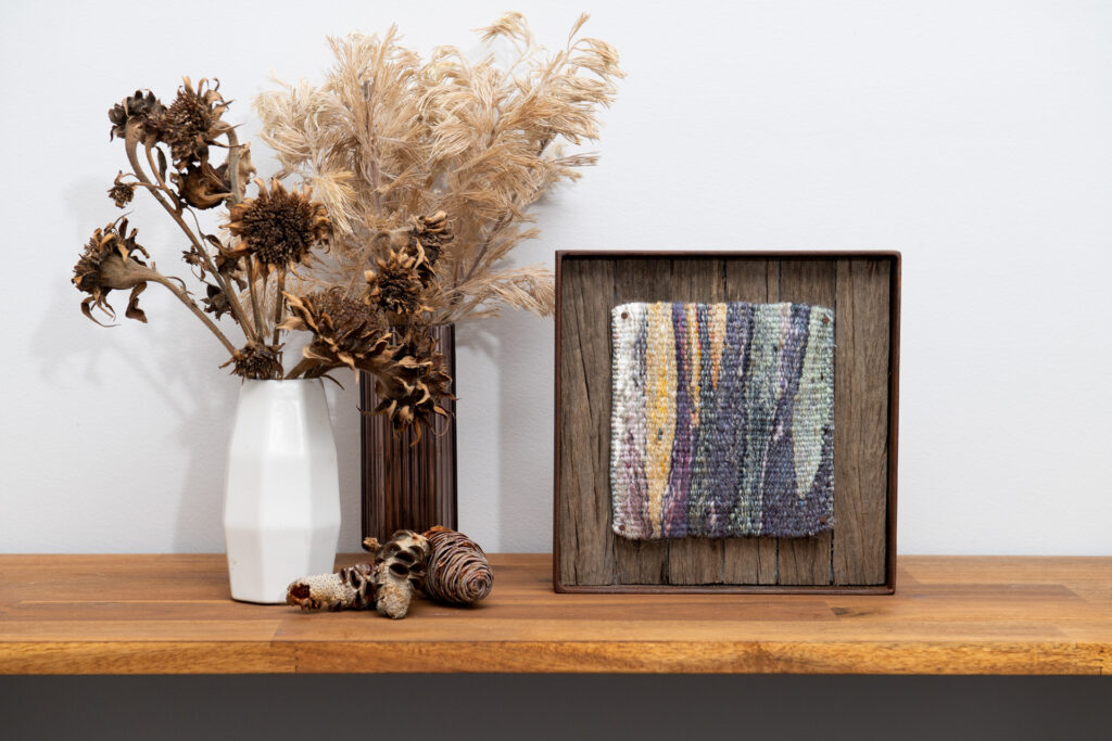 A styled image of a framed small format tapestry from the Specere collection